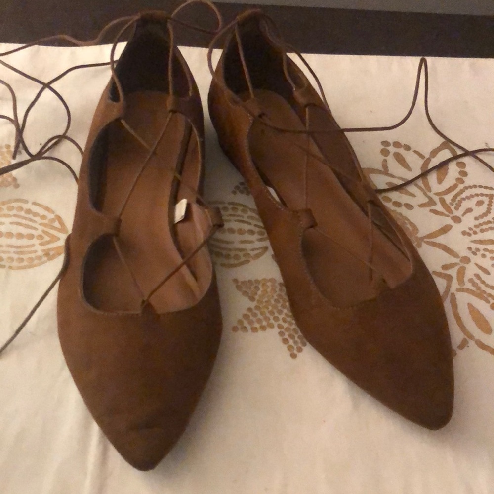 Brown tie up flats